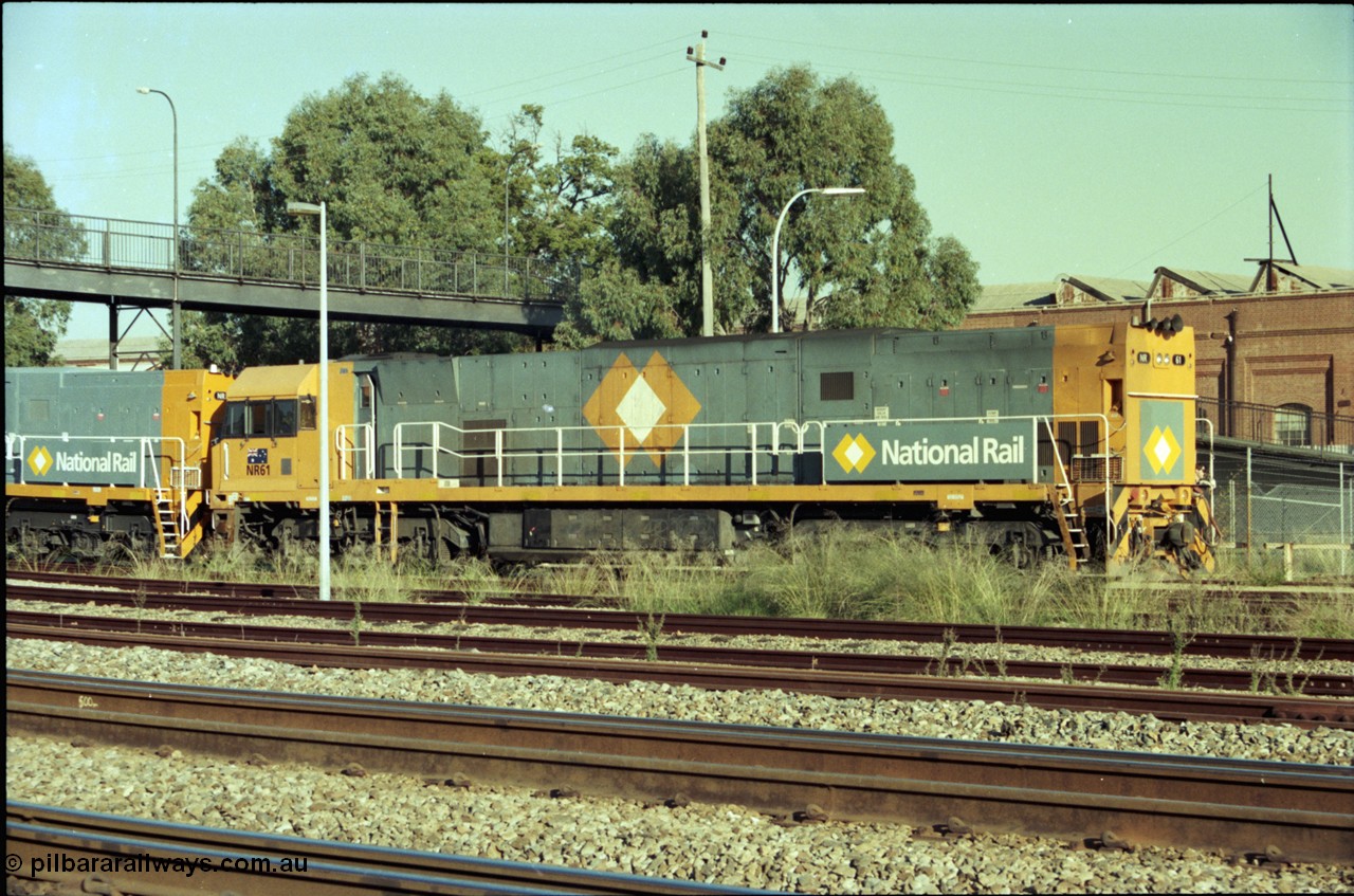 186-34
Midland, standard gauge yard, under the Midland Workshops footbridge, the first completed and built in Bassendean, National Rail NR class NR 61 Goninan GE model Cv40-9i serial 7250-11/96-263 trails new sisters NR 101 and NR 102 as they perform their shunt movement back out towards the mainline.
Keywords: NR-class;NR61;Goninan;GE;Cv40-9i;7250-11/96-263;