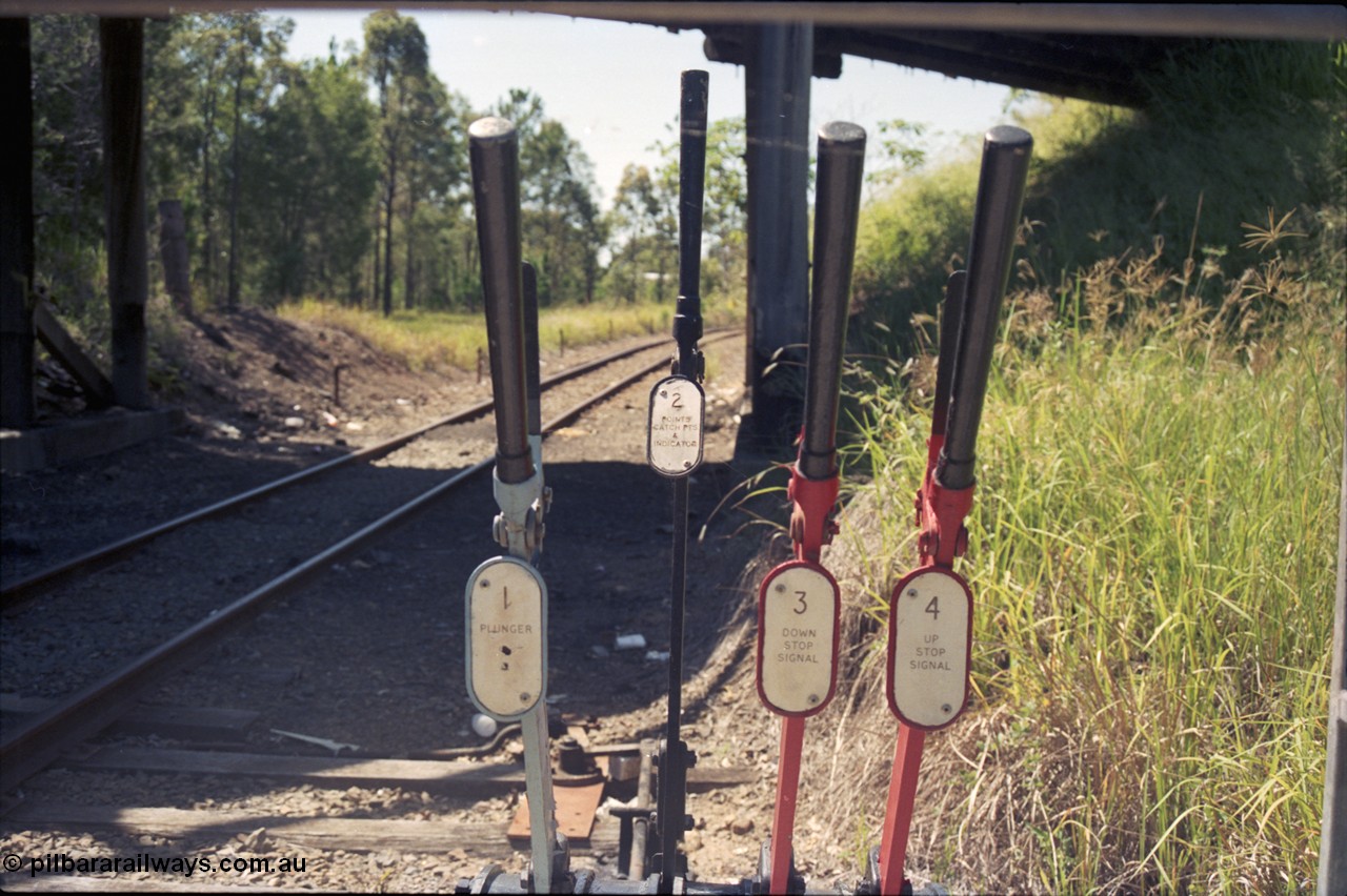 193-10
Moodlu Quarry junction ground frame signal levers. Looking east in the Up direction under the overbridge.
