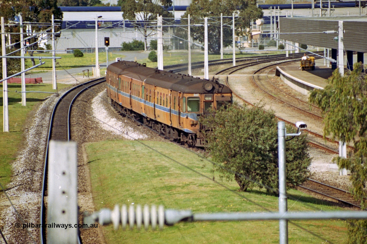 208-2-11
East Perth Passenger Terminal, diesel power narrow gauge commuter set operating under electric wiring.
