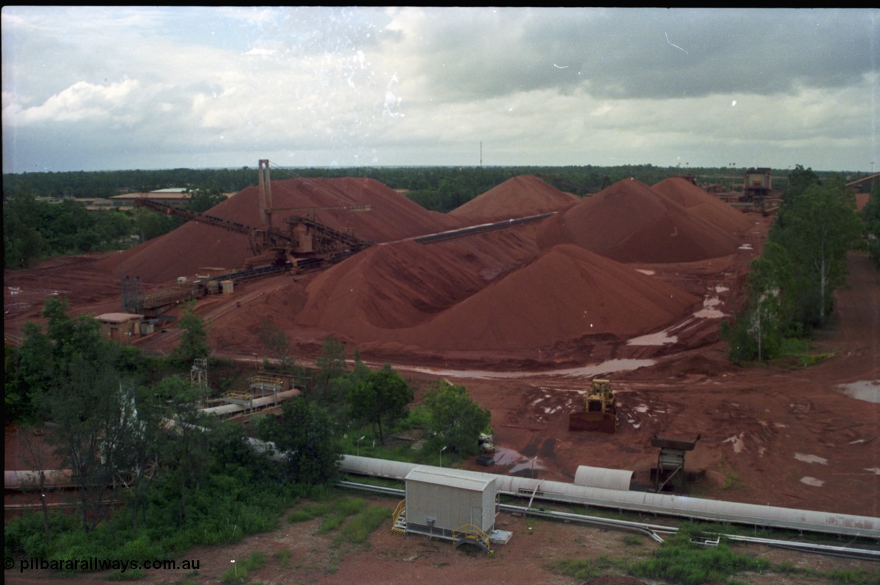 211-02
Weipa, Lorim Point, view from kaolin storage silos looking at the shiploading stockpile area of bauxite.
