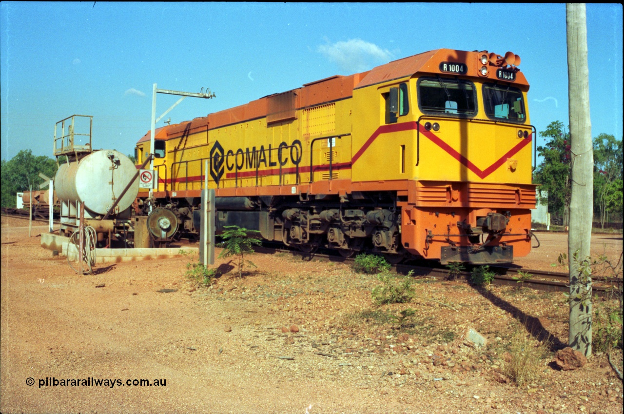 213-20
Weipa, Lorim Point fuel point, Comalco R 1004 loco Clyde Engineering built EMD model JT42C built 1990 serial 90-1277, weight 132 tonne, engine 12-710G3A, generator AR11-WBA-CA5, traction motors D87ETR, rated power 2460 kW/3300 hp. The body is similar to a V/Line N class while the components are the same as the Australian National AN class. Originally built for Goldsworthy Mining as GML 10 for use at their Western Australian iron ore railway and locally known as Cinderella. Purchased by Comalco in 1994 following the takeover of Goldsworthy by BHP.
Keywords: R1004;Clyde-Engineering-Kelso-NSW;EMD;JT26C;90-1277;Comalco;GML10;Cinderella;GML-class;