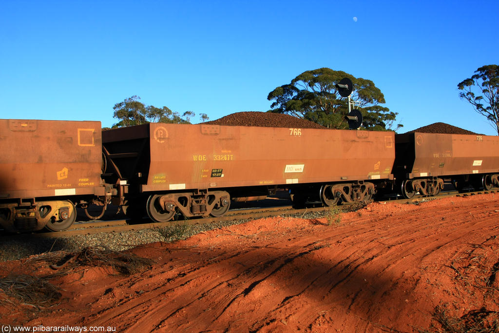 100731 02333
WOE type iron ore waggon WOE 33267 is one of a batch of thirty five built by Goninan WA between January and April 2005 with serial number 950104-007 and fleet number 766 for Koolyanobbing iron ore operations, on loaded train 6413 at Binduli Triangle, 31st July 2010.
Keywords: WOE-type;WOE33267;Goninan-WA;950104-007;