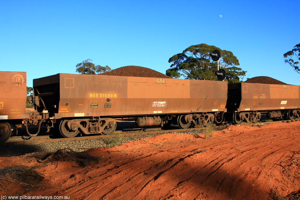 100731 02392
WOE type iron ore waggon WOE 31099 is one of a batch of one hundred and thirty built by Goninan WA between March and August 2001 with serial number 950092-089 and fleet number 684 for Koolyanobbing iron ore operations, on loaded train 6413 at Binduli Triangle, 31st July 2010.
Keywords: WOE-type;WOE31099;Goninan-WA;950092-089;