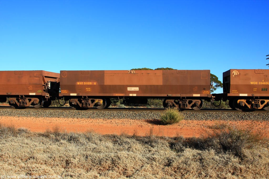 100731 02468
WOE type iron ore waggon WOE 31128 is one of a batch of one hundred and thirty built by Goninan WA between March and August 2001 with serial number 950092-118 and fleet number 710 for Koolyanobbing iron ore operations, on empty train 6418 at Binduli Triangle, 31st July 2010.
Keywords: WOE-type;WOE31128;Goninan-WA;950092-118;
