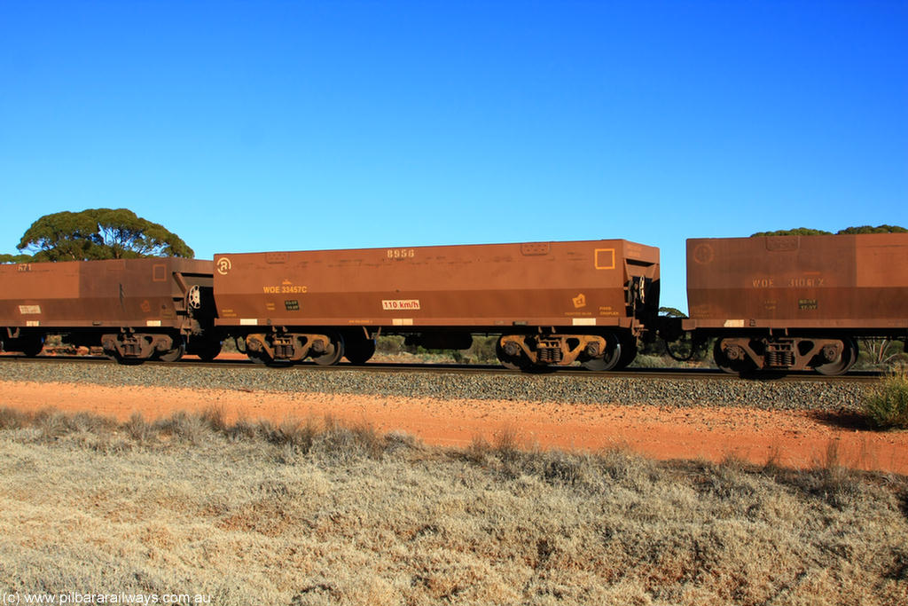 100731 02503
WOE type iron ore waggon WOE 33457 is one of a batch of five built by United Group Rail WA between August and September 2008 with serial number 950210-004 and fleet number 8956 for Koolyanobbing iron ore operations, on empty train 6418 at Binduli Triangle, 31st July 2010.
Keywords: WOE-type;WOE33457;United-Group-Rail-WA;950210-004;