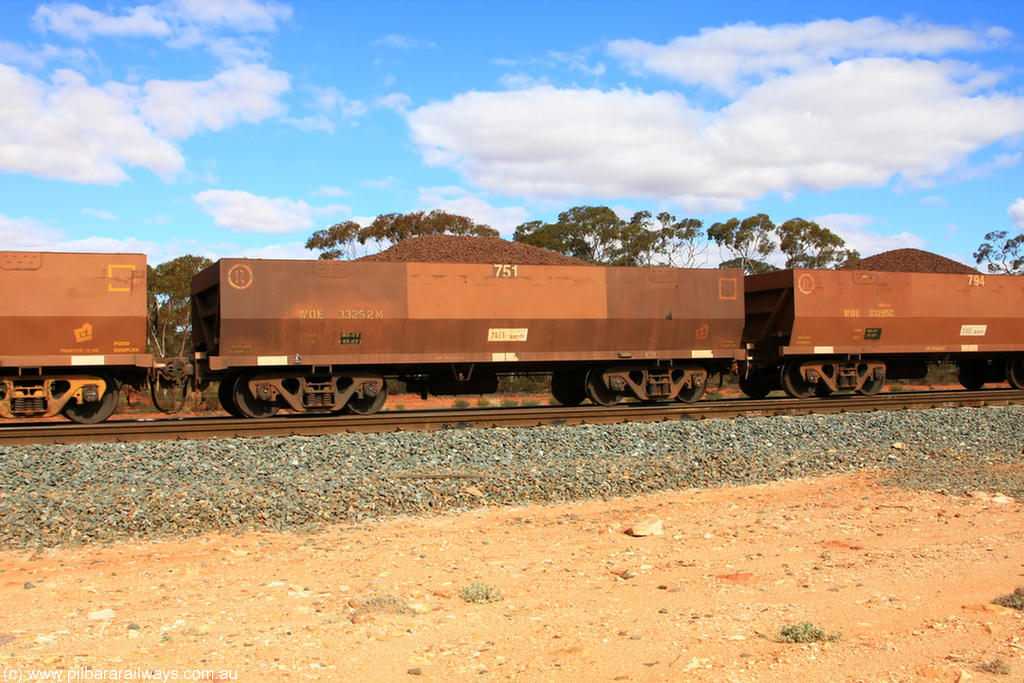 100731 02825
WOE type iron ore waggon WOE 33252 is one of a batch of twenty seven built by Goninan WA between September and October 2002 with serial number 950103-019 and fleet number 751 for Koolyanobbing iron ore operations, on loaded train 7415 at Binduli Triangle, 31st July 2010.
Keywords: WOE-type;WOE33252;Goninan-WA;950103-019;