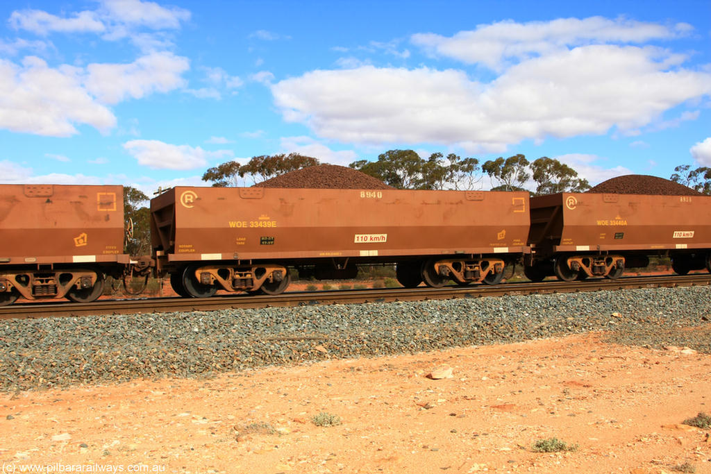 100731 02828
WOE type iron ore waggon WOE 33439 is one of a batch of seventeen built by United Group Rail WA between July and August 2008 with serial number 950209-003 and fleet number 8940 for Koolyanobbing iron ore operations, on loaded train 7415 at Binduli Triangle, 31st July 2010.
Keywords: WOE-type;WOE33439;United-Group-Rail-WA;950209-003;
