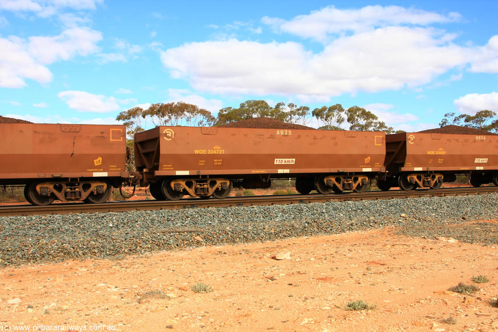 100731 02843
WOE type iron ore waggon WOE 33472 is one of a batch of one hundred and twenty eight built by United Group Rail WA between August 2008 and March 2009 with serial number 950211-014 and fleet number 8972 for Koolyanobbing iron ore operations, on loaded train 7415 at Binduli Triangle, 31st July 2010.
Keywords: WOE-type;WOE33472;United-Group-Rail-WA;950211-014;
