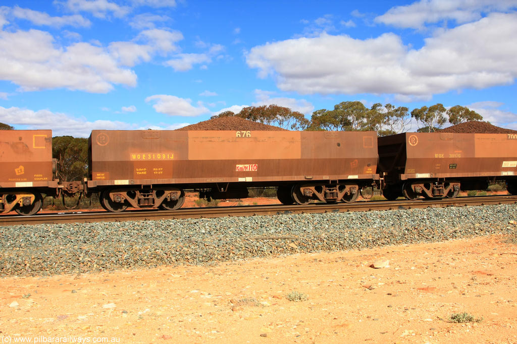 100731 02861
WOE type iron ore waggon WOE 31091 is one of a batch of one hundred and thirty built by Goninan WA between March and August 2001 with serial number 950092-081 and fleet number 676 for Koolyanobbing iron ore operations, on loaded train 7415 at Binduli Triangle, 31st July 2010.
Keywords: WOE-type;WOE31091;Goninan-WA;950092-081;