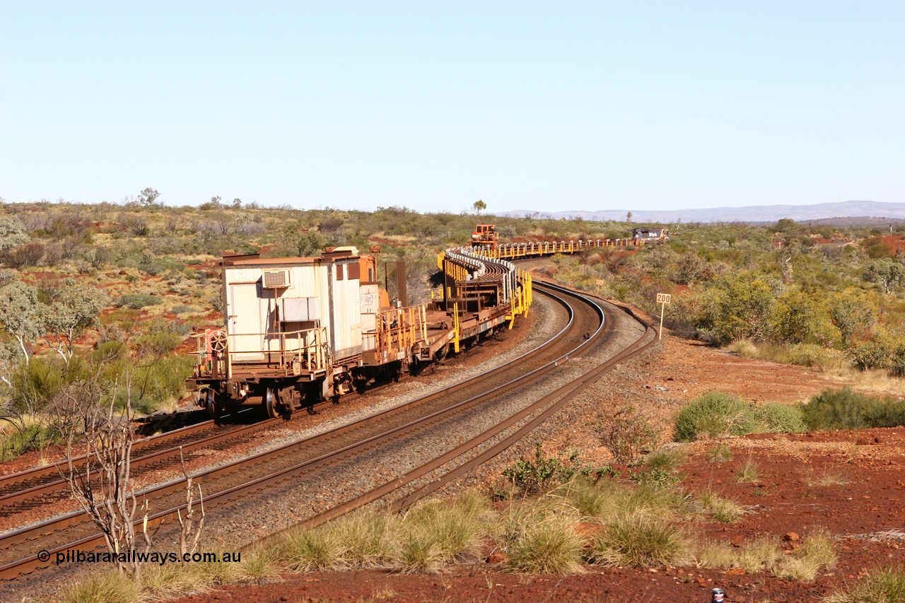 060714 6813
Hesta Siding, view from the rear of the rail recovery and transport train as it snakes around the curves. Crib waggon 665 a former Magor USA built ore waggon, heavily modified by Mt Newman Mining workshops and fitted with an ATCO donga.
Keywords: Mt-Newman-Mining-WS;Magor-USA;BHP-rail-train;