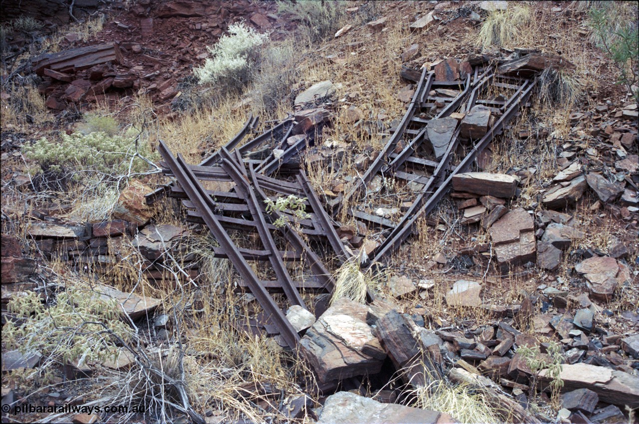194-02
Wittenoom Gorge, Colonial Mine, asbestos mining remains, pile of railway points or switches, two left handed and one right handed.
