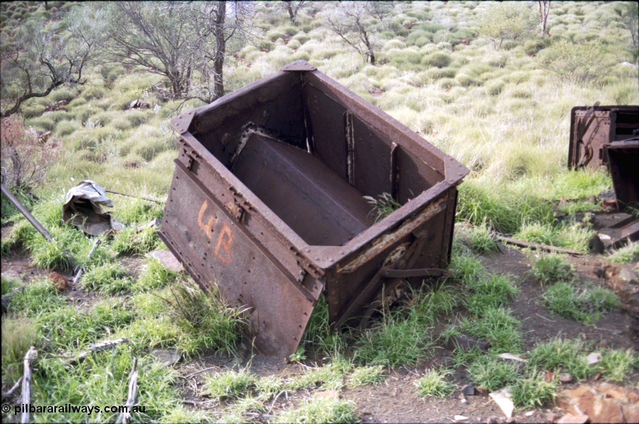 196-22
Wittenoom Gorge, Gorge Mine area, asbestos mining remains, view inside of side opening ore waggon, shows how much ore the waggons could carry.
