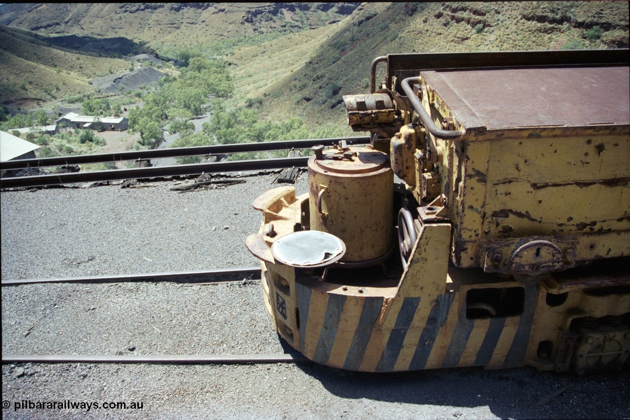 197-17
Wittenoom, Colonial Mine, asbestos mining remains, view looking across the drivers seat of Mancha battery locomotive #4 down the gorge towards Joffre Creek with the workshops building in the distance and some air under the dump track.
Keywords: Mancha;