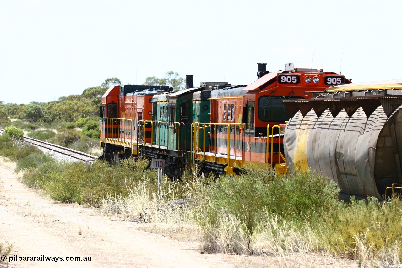 060111 2251
Tooligie, Mac's Road grade crossing at the 110 km, ARG 1200 class unit 1203, a Clyde Engineering EMD model G12C serial 65-427, one of fourteen originally built between 1960-65 for WAGR as their A class A 1513, fitted with dynamic brakes and financed by Western Mining Corporation, started working on the Eyre Peninsula in November 2004 leads an empty grain train north. 11th January 2006.
