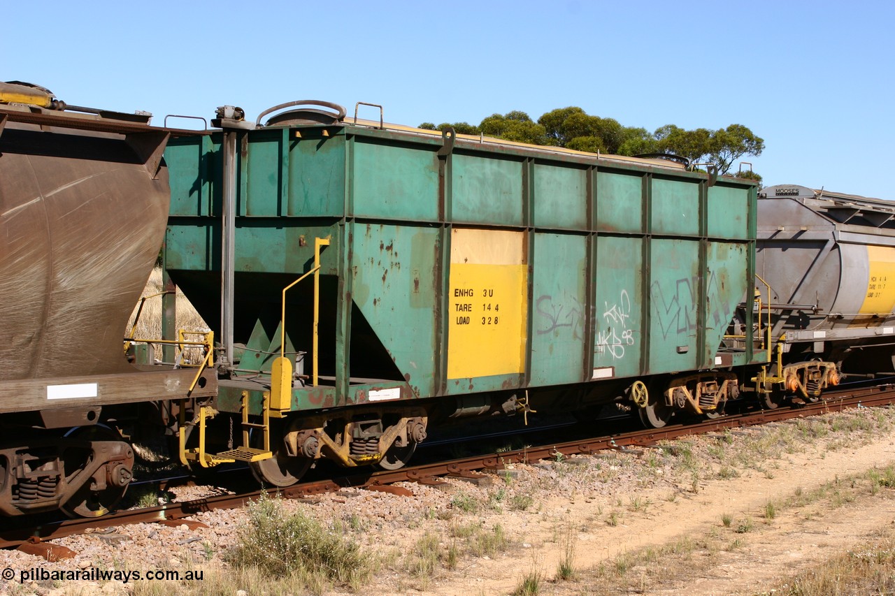 060111 2352
Kyancutta, former Australian National narrow gauge ENHG type bogie grain waggon ENHG 3, originally built by Moore Road Ind, Victoria as NB type NB 1398 ballast hopper for the NAR, then to standard gauge in 1975 as BA type BA 1540, recoded to AHTY in 1980, to EP April 1984, recoded to NHG type NHG 6 in May 1984, then again to ENHT type ENHT 6 in March 1985 and further rebuilt forming one half of ENHG type grain waggon in August 1986. The conversion involved splicing two AHTY-ENHT type waggons together at Port Lincoln workshops, roll top cover visible, part of an empty train. 11th January 2006.
Keywords: ENHG-type;ENHG3;Moore-Road-Ind-Victoria;NB-type;NB1398;BA-type;BA1540;AHTY-type;NHG-type;NHG6;ENHT-type;