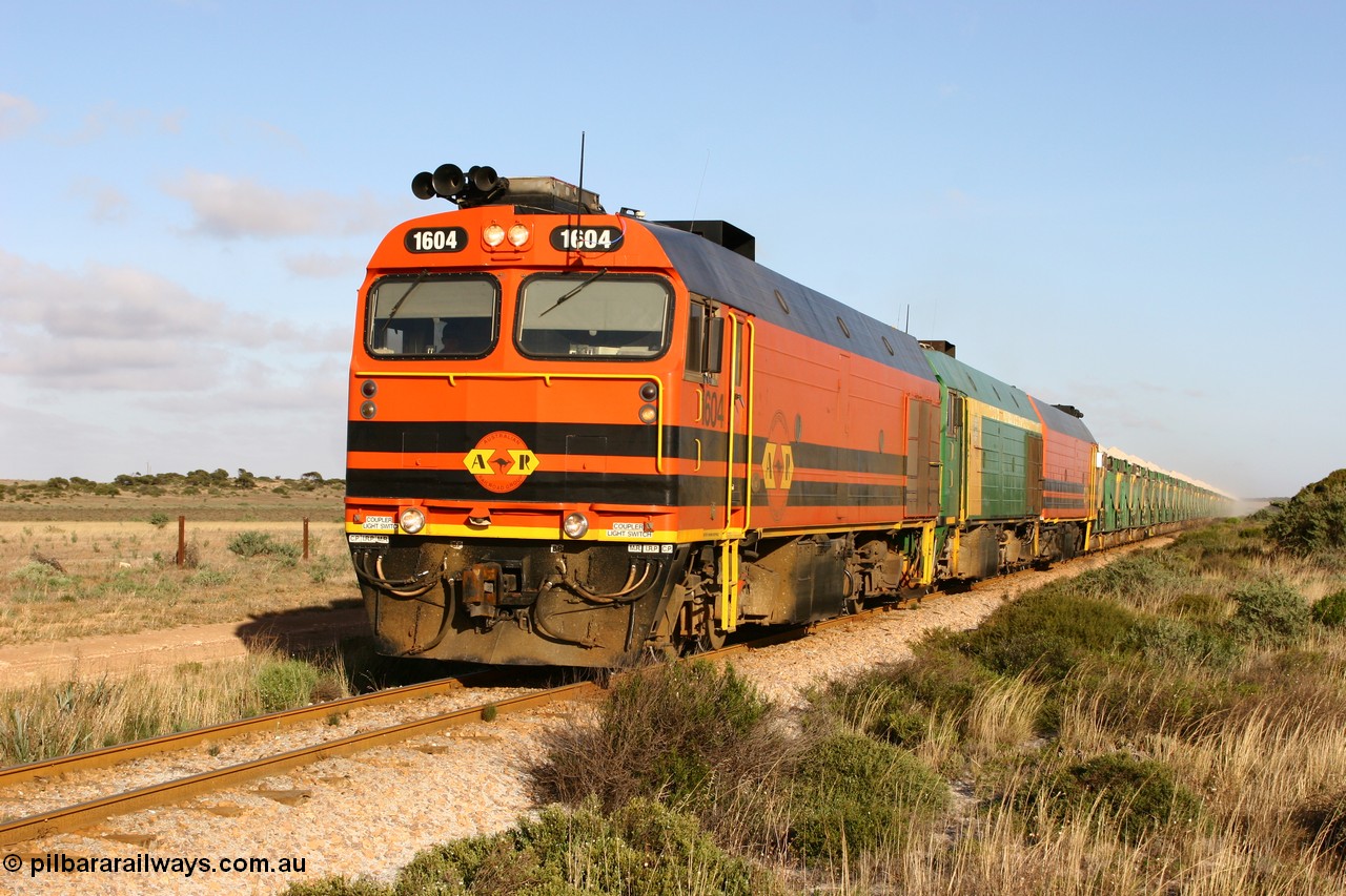 060113 2421
Ceduna, loaded gypsum train 6DD2 stirs up the dust behind the triple Clyde Engineering EMD JL22C model 1600 / NJ class combination of 1604 serial 71-731 and originally NJ 4, NJ 3 serial 71-730 and 1601 serial 71-728 class leader NJ 1, all three units started on the Central Australia Railway in 1971 and were transferred to the Eyre Peninsula in 1981. 08:10 AM on the Friday the 13th January 2006.
Keywords: 1600-class;1604;Clyde-Engineering-Granville-NSW;EMD;JL22C;71-731;NJ-class;NJ4;