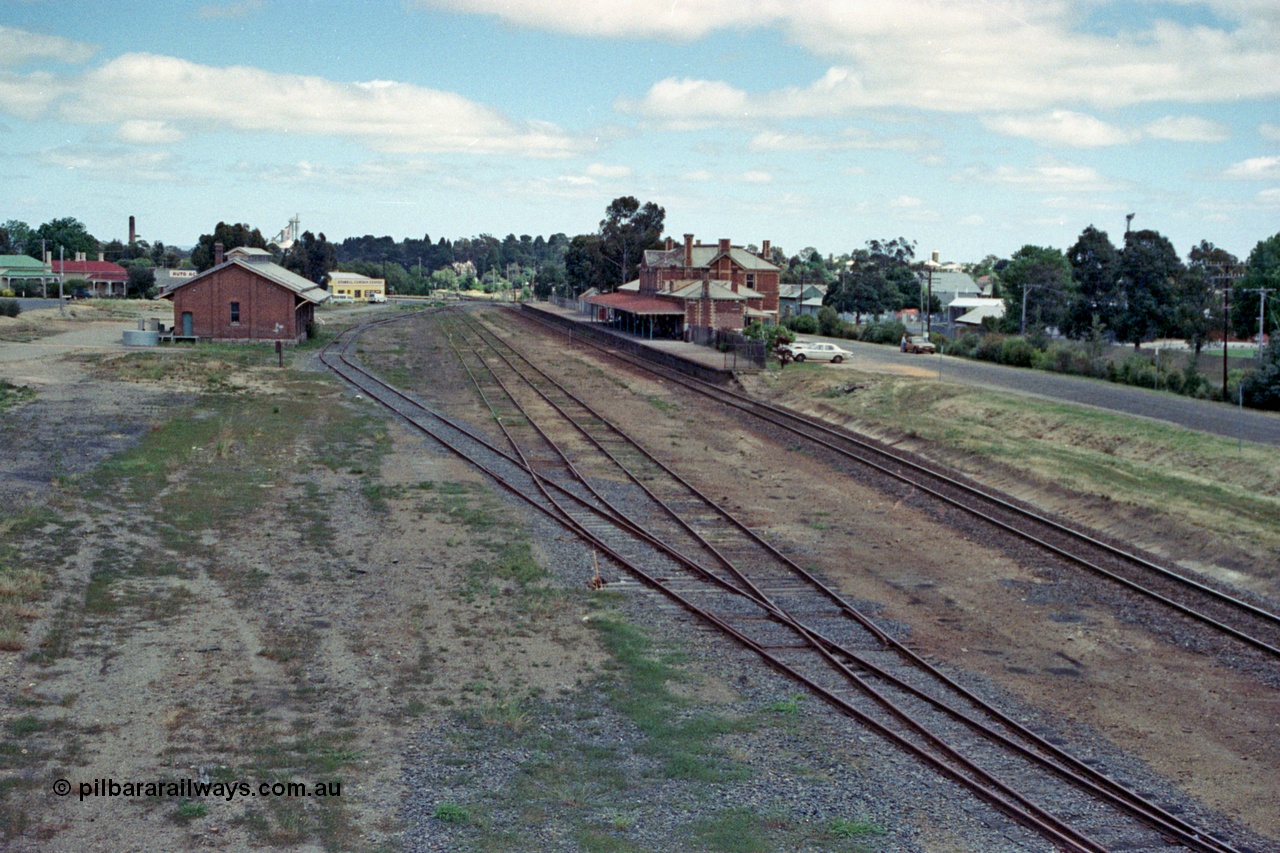 104-01
Stawell station yard overview looking west, goods shed, station building and platform.
