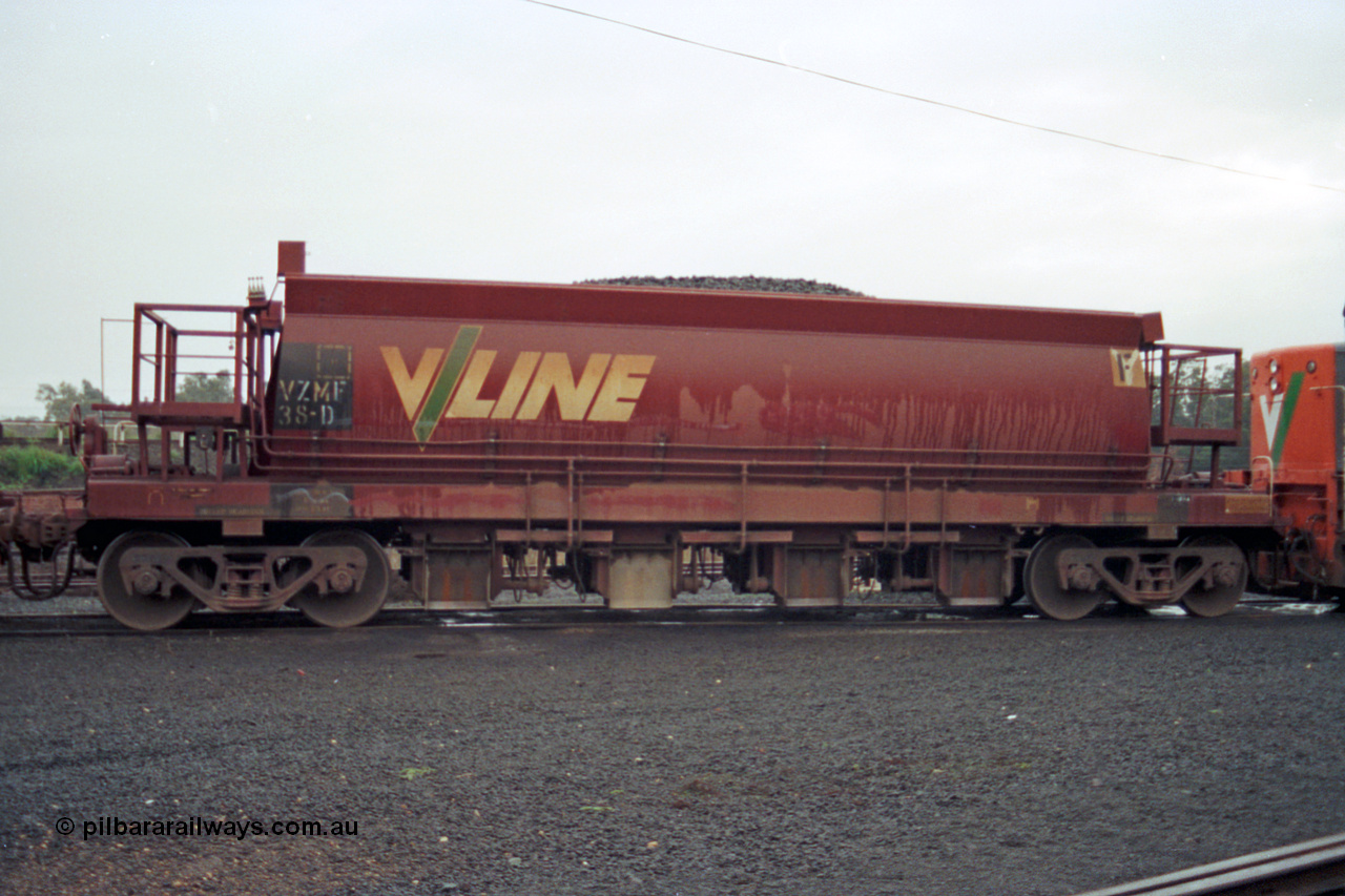 106-21
Seymour loco depot, broad gauge V/Line VZMF type bogie ballast waggon VZMF 38, side view.
Keywords: VZMF-type;VZMF38;