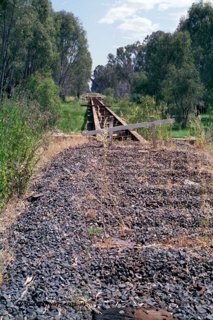 118-17
Tocumwal line, view of third bridge, deck removed, looking south, track removed, line out of service. [url=https://goo.gl/maps/SBYc5kCqFAEzEqjg7]Geo data[/url].
