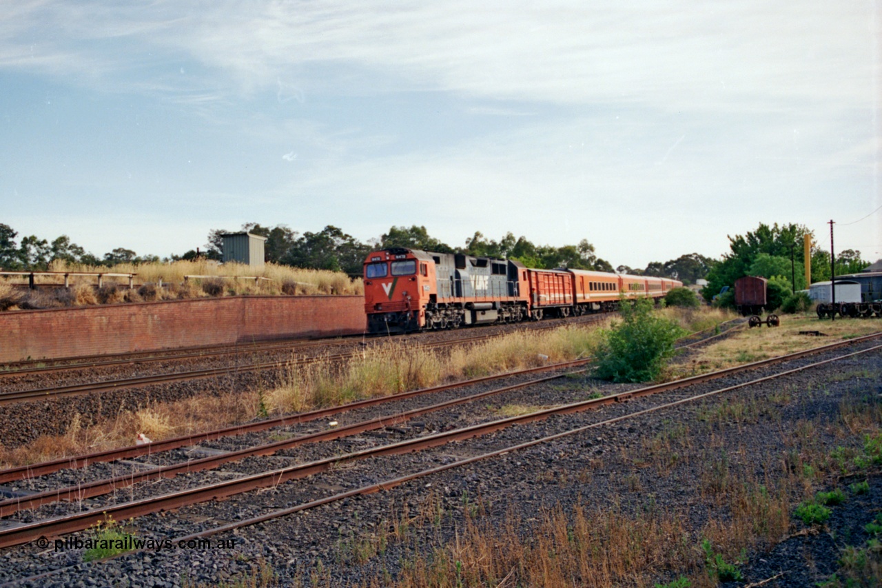 137-1-07
Seymour loco depot, broad gauge V/Line N class N 472 'City of Sale' Clyde Engineering EMD model JT22HC-2 serial 87-1201 leads the morning up Albury pass past the depot at speed, from the brick wall is the line to Cobram and Tocumwal broad gauge, the Wodonga - Albury broad gauge and the Albury standard gauge line, then the standard gauge loco sidings, the depot and turntable are to the right.
Keywords: N-class;N472;Clyde-Engineering-Somerton-Victoria;EMD;JT22HC-2;87-1201;