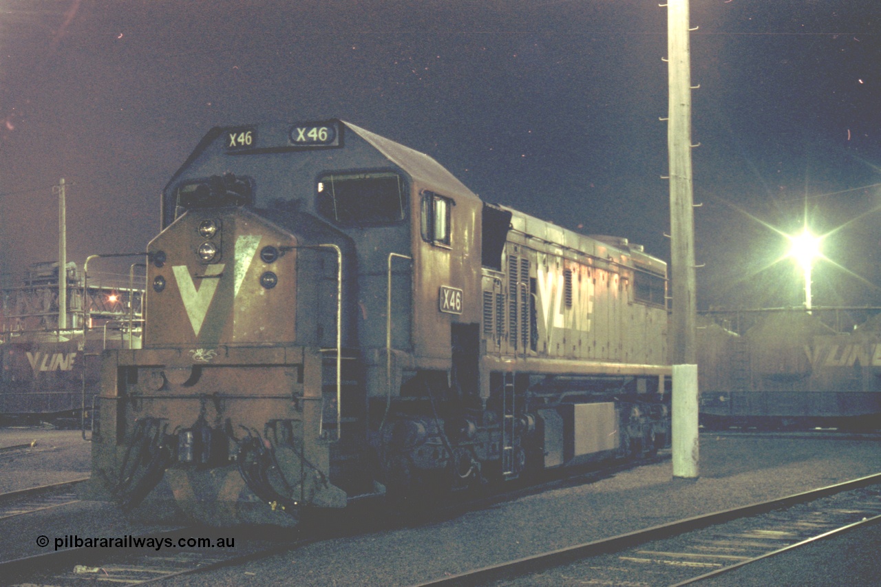 153-3-30
Geelong loco depot, stabled V/Line broad gauge locomotive X class X 46 Clyde Engineering EMD model G26C serial 75-793, night shot.
Keywords: X-class;X46;Clyde-Engineering-Rosewater-SA;EMD;G26C;75-793;