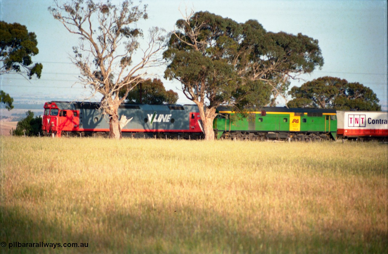 159-07
Bank Box Loop, down Adelaide bound broad gauge goods train hauled by V/Line G class G 540 Clyde Engineering EMD model JT26C-2SS serial 89-1273 and Australian National 700 class 704 AE Goodwin ALCo model DL500G serial G6059-2, off focus.
Keywords: G-class;G540;Clyde-Engineering-Somerton-Victoria;EMD;JT26C-2SS;89-1273;
