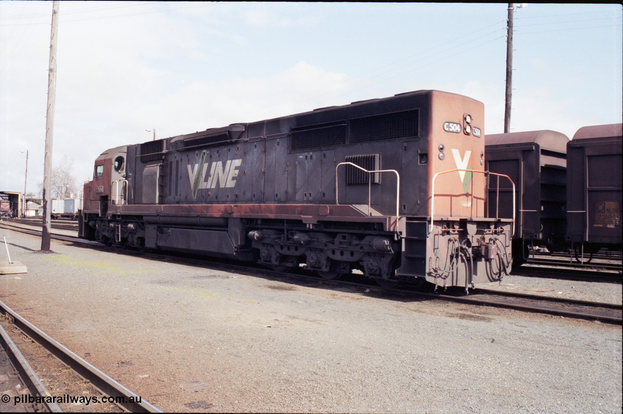 165-15
Albury loco depot, standard gauge V/Line C class locomotive C 504 Clyde Engineering EMD model GT26C serial 76-827 stands beside some NSWSRA NLDF class vans, trailing view.
Keywords: C-class;C504;Clyde-Engineering-Rosewater-SA;EMD;GT26C;76-827;