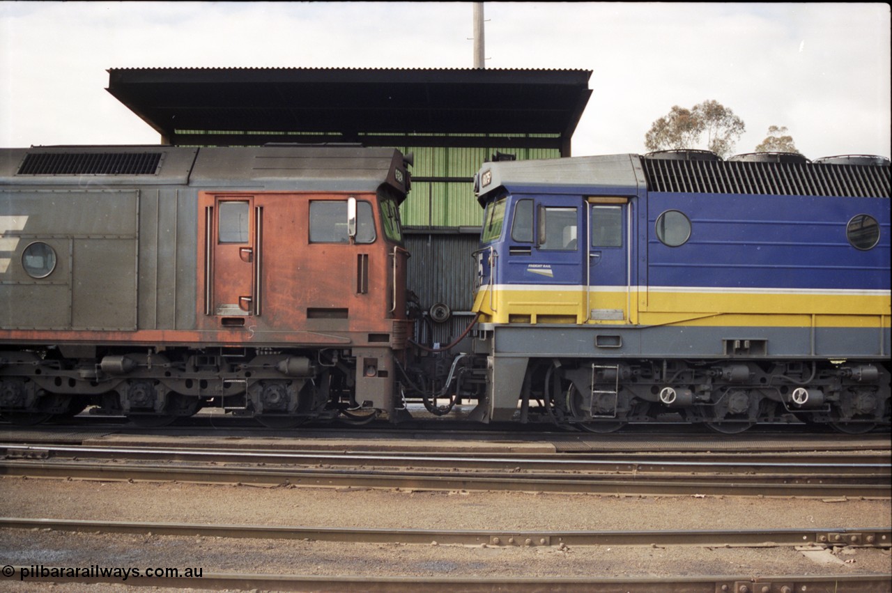 165-23
Albury loco depot fuel point, cab to cab standard gauge locos of V/Line G class G 524 Clyde Engineering EMD model JT26C-2SS serial 86-1237 and NSWSRA 81 class 8175 Clyde Engineering EMD model JT26C-2SS serial 85-1094.
Keywords: G-class;G524;Clyde-Engineering-Rosewater-SA;EMD;JT26C-2SS;86-1237;