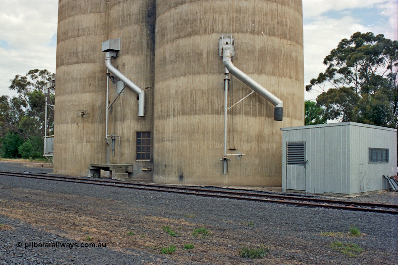 175-17
Pine Lodge, track view looking at load-out spouts on Williamstown style silo complex, staff / storage shed.
