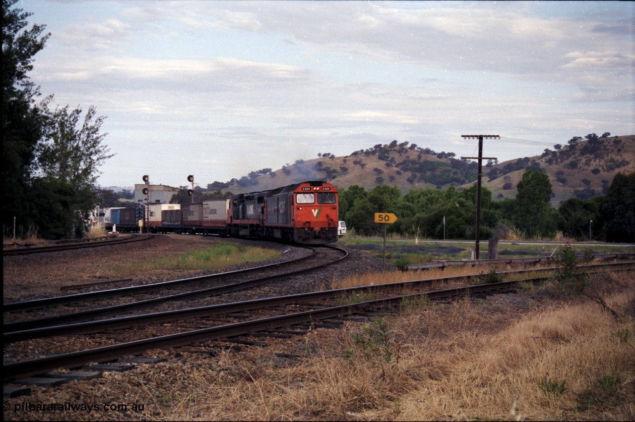 176-11
Wodonga, V/Line standard gauge up goods train passing the Wodonga Coal Sidings behind the G class G 524 Clyde Engineering EMD model JT26C-2SS serial 86-1237 and C class C 505 Clyde Engineering EMD model GT26C serial 76-828 combination, broad gauge track on the left, and the former broad gauge line to Bandiana and Cudgewa curving around to the right.
Keywords: G-class;G524;Clyde-Engineering-Rosewater-SA;EMD;JT26C-2SS;86-1237;