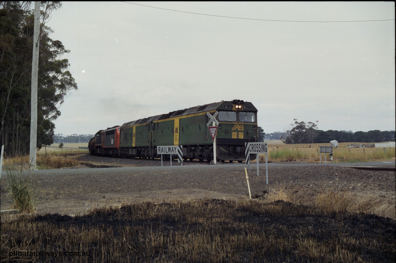 178-06
Lismore, down V/Line broad gauge goods train to Adelaide 9169 runs round the curve as it crosses Gnarpurt Road with the quad combo of a pair of Australian National BL class locomotives BL 27 Clyde Engineering EMD model JT26C-2SS serial 83-1011 and class leader BL 26 'Bob Hawke' serial 83-1010 and V/Line S class S 313 'Alfred Deakin' Clyde Engineering EMD model A7 serial 61-230 and X class X 53 Clyde Engineering EMD model G26C serial 75-800, BL 27 had Paul Keating drawn on the LHS cab as it was just after he'd taken the Labor Party leadership and the Prime Ministership off Bob Hawke.
Keywords: BL-class;BL27;Clyde-Engineering-Rosewater-SA;EMD;JT26C-2SS;88-1011;