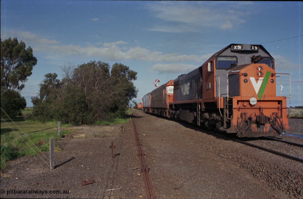 179-37
Gheringhap, track view looking east towards Geelong from the former up platform see V/Line broad gauge light engines departing for North Geelong C with failed X class X 50 Clyde Engineering EMD model G26C serial 75-797 which was taken of 9169 down goods, locked away down grain train 9121 can be seen in Siding A awaiting line clear and semaphore signal post is pulled off for the move.
Keywords: X-class;X51;Clyde-Engineering-Rosewater-SA;EMD;G26C;75-798;