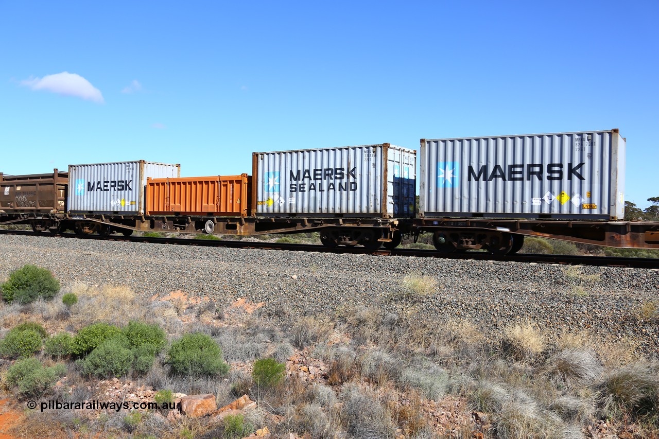 161111 2485
Binduli, Kalgoorlie Freighter train 5025, container flat waggon AQWY 31006, one of a batch of eighteen built by Westrail Midland Workshops in 1981 as WFA type, to WQCY type in 1987, to RHQY in 1994 then back to WQCY in 1995, seen here loaded with two 20' 22G1 type Maersk boxes for lead nitrate, MSKU 336235 and MSKU 438595 and a 20' half height box for Nickel West NIWU 100079 that normally contains quartz for the smelter.
Keywords: AQWY-type;AQWY31006;Westrail-Midland-WS;WFA-type;WQCY-type;