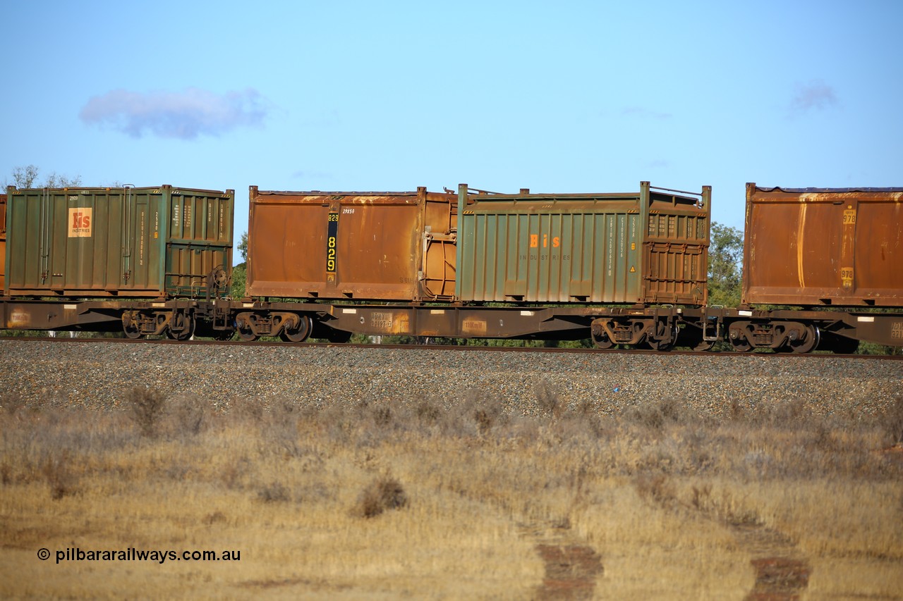 161111 2403
Kalgoorlie, Malcolm freighter train 5029, waggon AQNY 32187 one of sixty two waggons built by Goninan WA in 1998 as WQN type for Murrin Murrin container traffic, with a Bis Industries roll top 55UA type sulphur container SBIU 200636 and original style sulphur container S61H 829 with original style door and sliding tarpaulin.
Keywords: AQNY-type;AQNY32187;Goninan-WA;WQN-type;