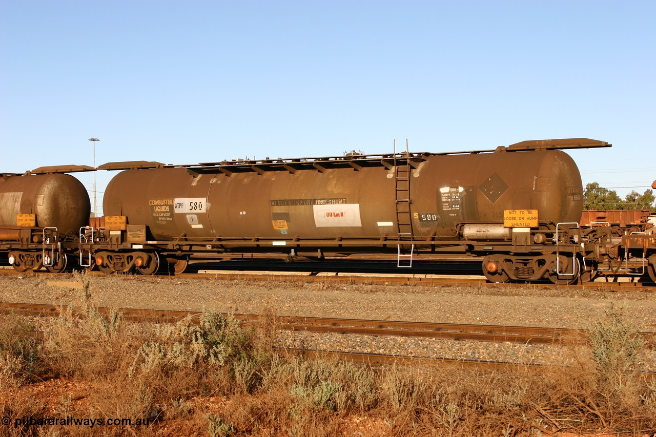 060528 4650 ATPF580F
West Kalgoorlie, ATPF 580 fuel tank waggon built by WAGR Midland Workshops 1976 for Shell as type WJP, 80.66 kL one compartment one dome, capacity of 80500 litres, it also spent time in SA in 1985, fitted with type F InterLock couplers, Shell Fleet no. TR715 still visible.
Keywords: ATPF-type;ATPF580;WAGR-Midland-WS;WJP-type;