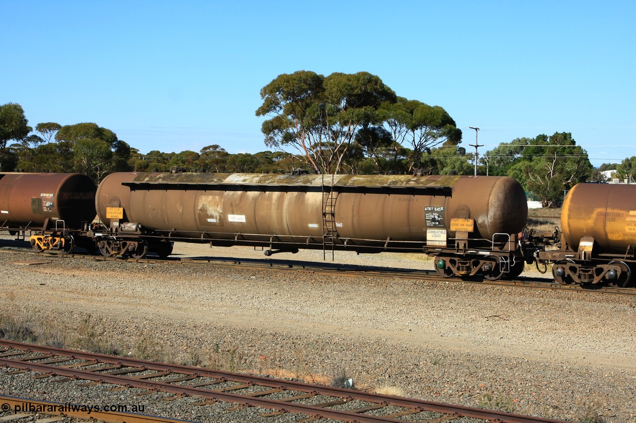 100602 8593
West Kalgoorlie, ATKY 545 fuel tank waggon built by Tulloch Ltd NSW for ESSO Australia 1975 as a WJK type capacity of 105000 litres, sold to BP Oil in 1986, current capacity is probably 80500 litres in line with the rest of the fleet.
Keywords: ATKY-type;ATKY545;Tulloch-Ltd-NSW;WJK-type;