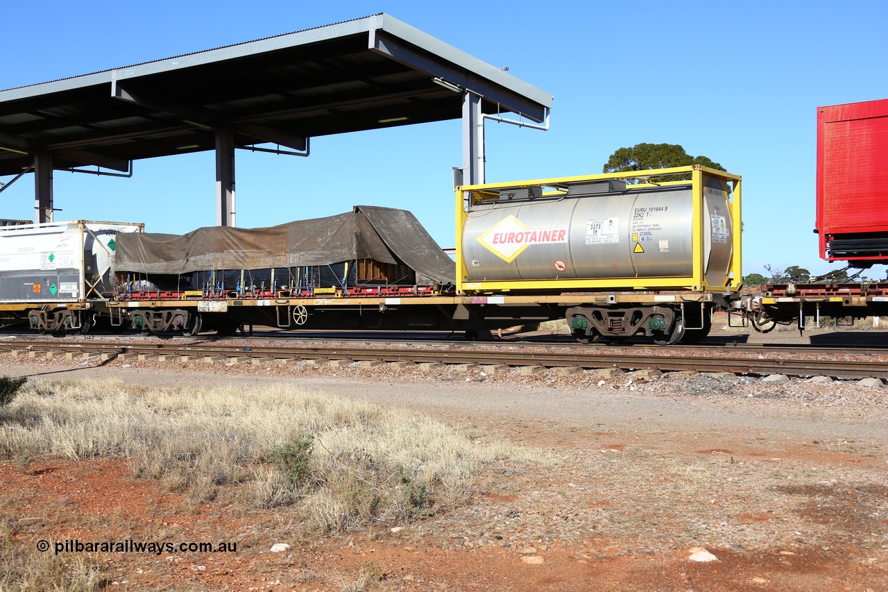 160522 2127
Parkeston, 6MP4 intermodal train, RQAY 21907 container waggon, one of a hundred waggons built in 1981 by EPT NSW as type NQAY, recoded to RQAY in 1994, with CIMC Tank built 20' ISO 22K2 type tanktainer for Eurotainer EURU 191844 with ammonium nitrate emulsion and a K&S 40' flatrack KT 400234 with a tarped load.
Keywords: RQAY-type;RQAY21907;EPT-NSW;NQAY-type;