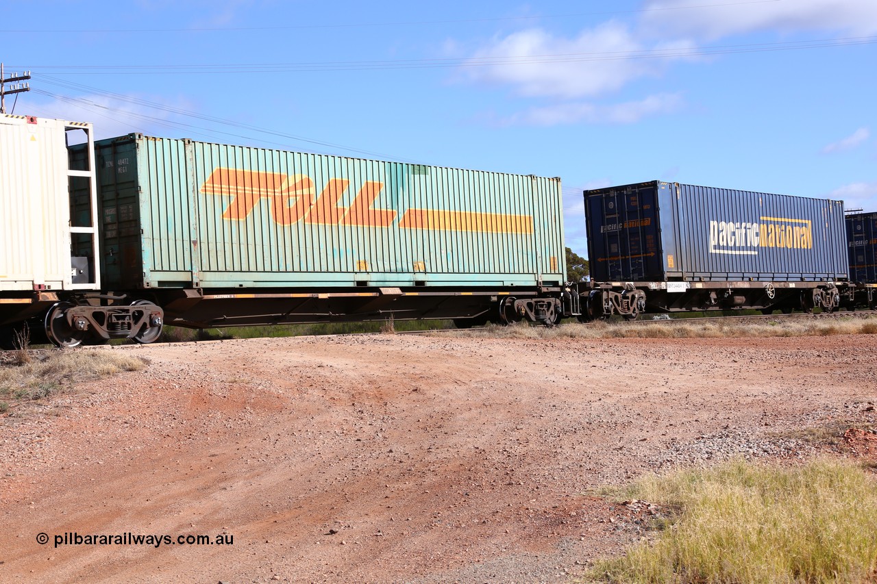 160522 2374
Parkeston, 7MP7 priority service train, RQQY 7077 platform 5 of 5-pack articulated skel waggon set, 1 of 17 built by Qld Rail at Ipswich Workshops in 1995, Toll 48' box TCML 48472.
Keywords: RQQY-type;RQQY7077;Qld-Rail-Ipswich-WS;