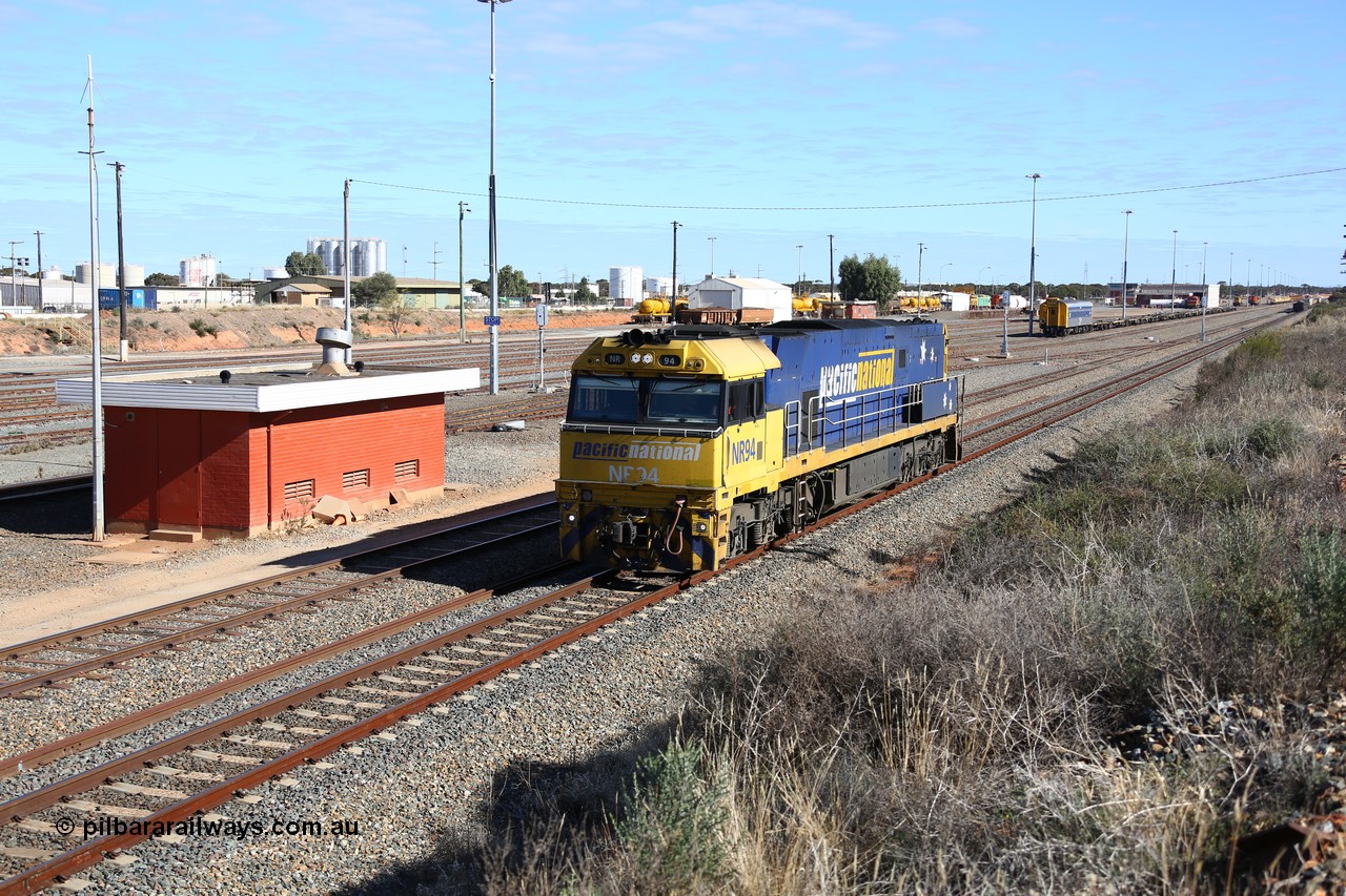 160531 9880
West Kalgoorlie, Pacific National's Goninan built GE model Cv40-9i NR class unit NR 94 serial 7250-06/97-300, shunts off 3PM4 steel train to collect the loading and crew coach sitting in the yard. 31st of May 2016.
Keywords: NR-class;NR94;Goninan;GE;Cv40-9i;7250-06/97-300;