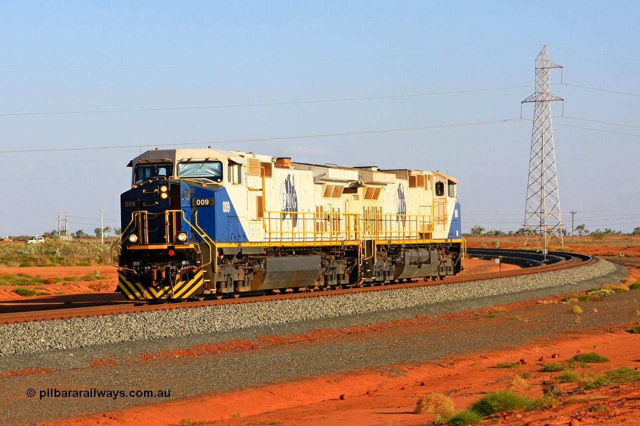 090912 2249r
Boodarie, at the 5 km curve between the Great Northern Highway and the car dumper balloon FMG General Electric built Dash 9-44CW light engines 009 serial 58186 and class leader 001 serial 58178 return to the port under Proceed Authority 56 following refuelling at Rowley Yard. 12th September 2009.
Keywords: FMG-009;GE;Dash-9-44CW;58186;