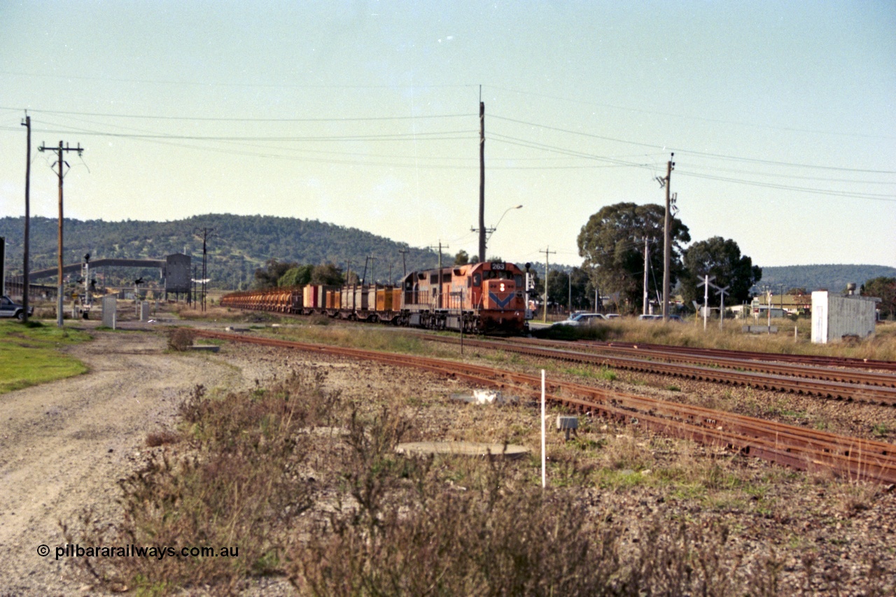 186-01
Midland, Westrail standard gauge up Kalgoorlie loaded acid train 428 crosses Lloyd Street behind a pair of L class locomotives L 263 Clyde Engineering EMD model GT26C, serial 68-553 and L 274 serial 73-779, with the dual gauge track to the Flashbutt Yard in the foreground. The empty return working of this train was 027 empty acid.
Keywords: L-class;L263;Clyde-Engineering-Granville-NSW;EMD;GT26C;68-553;