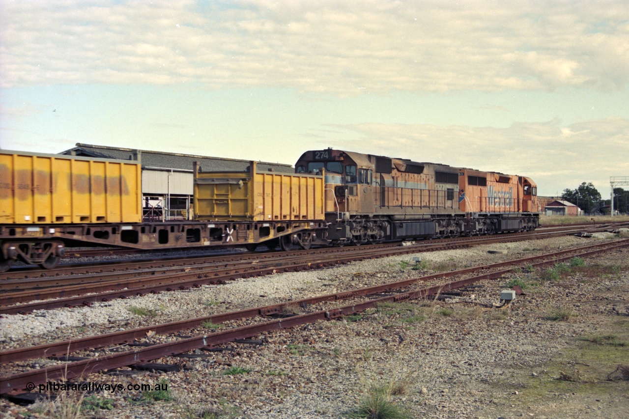 186-02
Midland, Westrail standard gauge up Kalgoorlie loaded acid train 428 behind a pair of L class locomotives L 263 Clyde Engineering EMD model GT26C serial 68-553 and L 274 built by Comeng Qld serial 73-779 in 1973 for Western Mining Corporation, with nickel containers as part of the loading, the narrow gauge track to the Flashbutt yard in the foreground and Midland Workshops behind train.
Keywords: L-class;L274;Comeng-Qld;EMD;GT26C;73-779;
