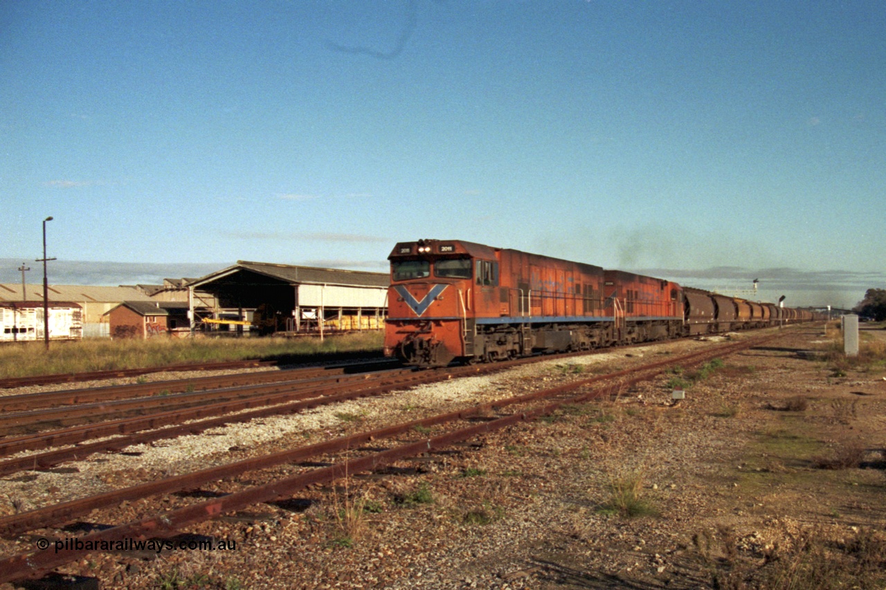 186-10
Midland, empty narrow gauge grain train 283 rumbles past Midland Workshops behind a pair of Westrail P class locomotives P 2011 'Shire of Narembeen' Goninan GE model CM25-8 serial 6320-09/90-096 and P 2006 'Shire of Quairading' serial 6320-05/90-091.
Keywords: P-class;P2011;Goninan;GE;CM25-8;90-096;