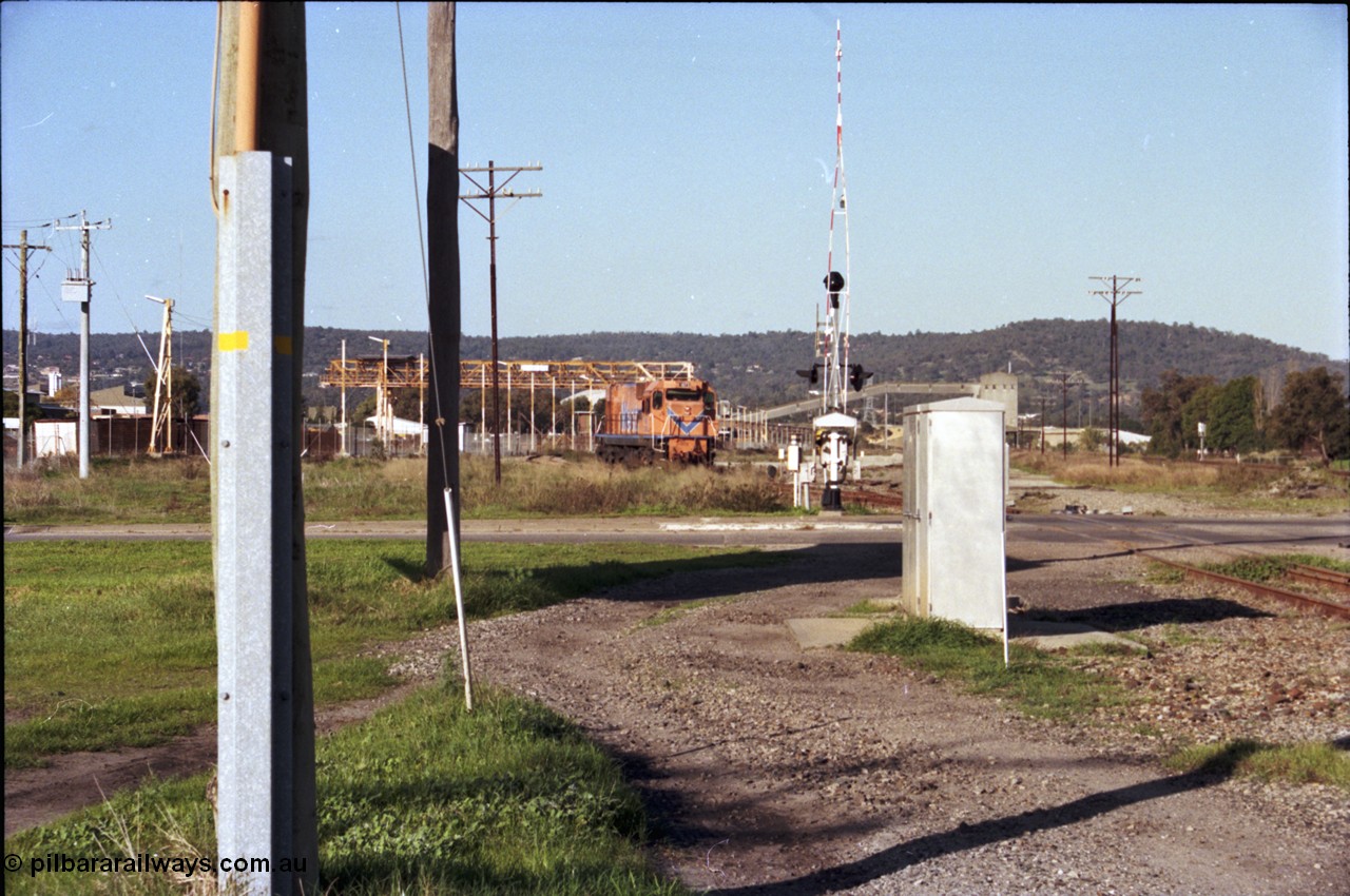 186-22
Bellevue, Westrail standard gauge light engine movement, train 168 stands in the flashbutt sidings prior to departure back to Forrestfield. Locomotive NB class NB 1873 Comeng built ALCo model CE618 serial WA-79 / C6099-3. This unit was originally a WAGR N class on narrow gauge, then reclassed to NA when fitted with air brakes in 1983, and then fitted with ex Mt Newman Mining ALCo M636 bogies in 1994 and classed NB.
Keywords: NB-class;NB1873;Comeng-WA;ALCo;CE618;WA-79/C6099-3;N-class;NA-class;rebuild;