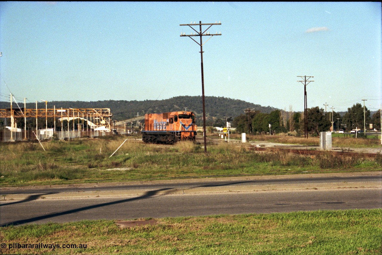 186-24
Bellevue, Westrail standard gauge light engine movement, train 168 stands in the flashbutt sidings prior to departure back to Forrestfield. NB class locomotive NB 1873 a Comeng built ALCo model CE618 serial WA-79 / C6099-3. This unit was originally a WAGR N class on narrow gauge, then reclassed to NA when fitted with air brakes in 1983, and then fitted with ex Mt Newman Mining ALCo M636 bogies in 1994 and classed NB.
Keywords: NB-class;NB1873;Comeng-WA;ALCo;CE618;WA-79/C6099-3;N-class;NA-class;rebuild;