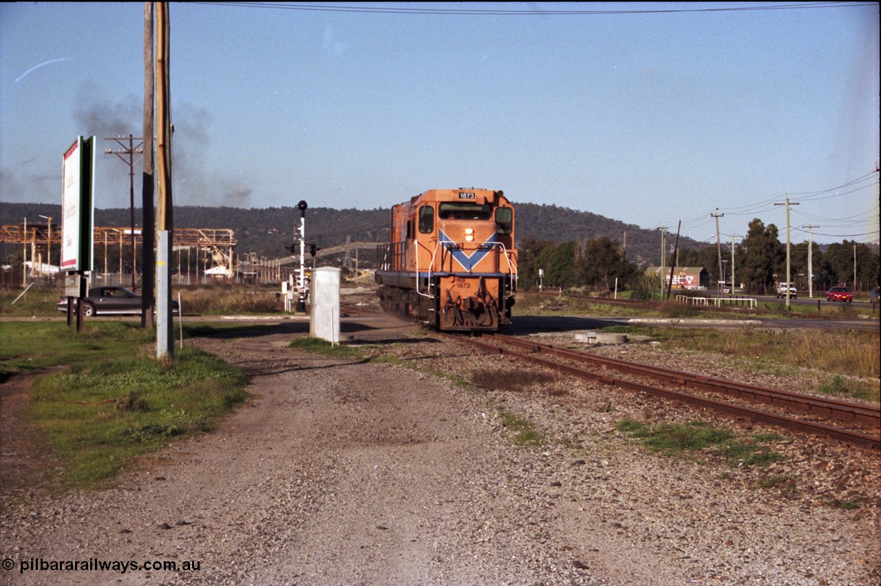 186-25
Bellevue, Westrail standard gauge light engine movement, train 168 departs the flashbutt sidings crossing Lloyd Street bound for Forrestfield. NB class locomotive NB 1873 a Comeng built ALCo model CE618 serial WA-79 / C6099-3. This unit was originally a WAGR N class on narrow gauge, then reclassed to NA when fitted with air brakes in 1983, and then fitted with ex Mt Newman Mining ALCo M636 bogies in 1994 and classed NB.
Keywords: NB-class;NB1873;Comeng-WA;ALCo;CE618;WA-79/C6099-3;N-class;NA-class;rebuild;