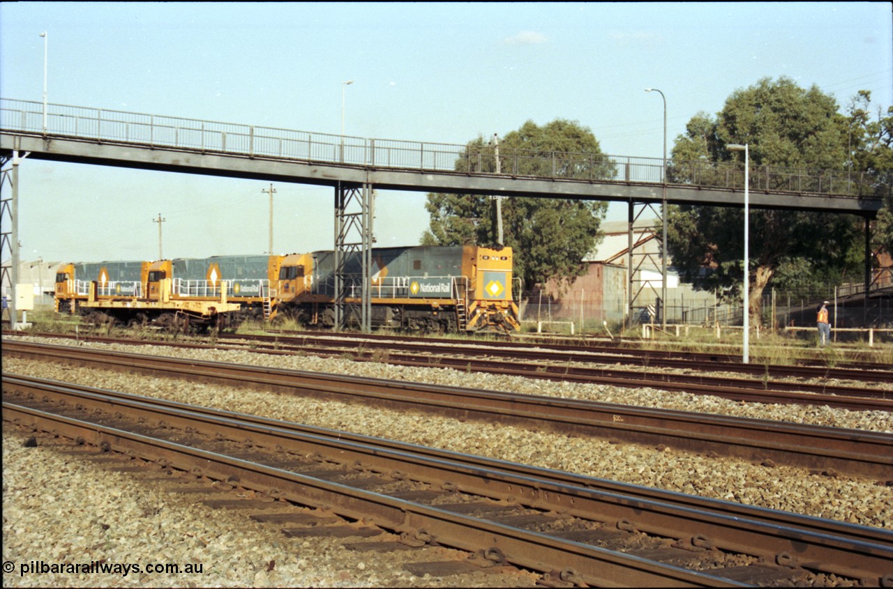 186-31
Midland, standard gauge yard, brand new Perth built National Rail NR class units NR 102 Goninan GE model Cv40-9i serial 7250-07/97-302 and NR 101 serial 7250-07/97-303 shunt out of the yard with the first built sister NR 61 serial 7250-11/96-263.
Keywords: NR-class;NR61;Goninan;GE;Cv40-9i;7250-11/96-263;