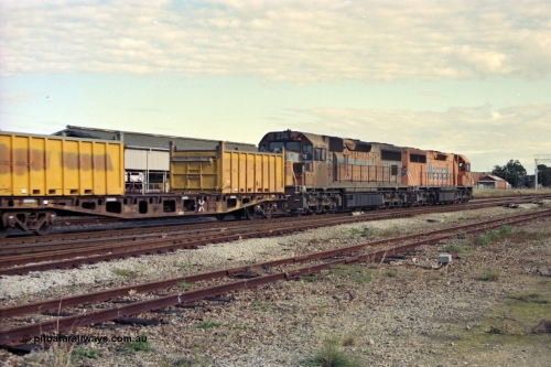 186-02
Midland, Westrail standard gauge up Kalgoorlie loaded acid train 428 behind a pair of L class locomotives L 263 Clyde Engineering EMD model GT26C serial 68-553 and L 274 built by Comeng Qld serial 73-779 in 1973 for Western Mining Corporation, with nickel containers as part of the loading, the narrow gauge track to the Flashbutt yard in the foreground and Midland Workshops behind train.
Keywords: L-class;L274;Comeng-Qld;EMD;GT26C;73-779;