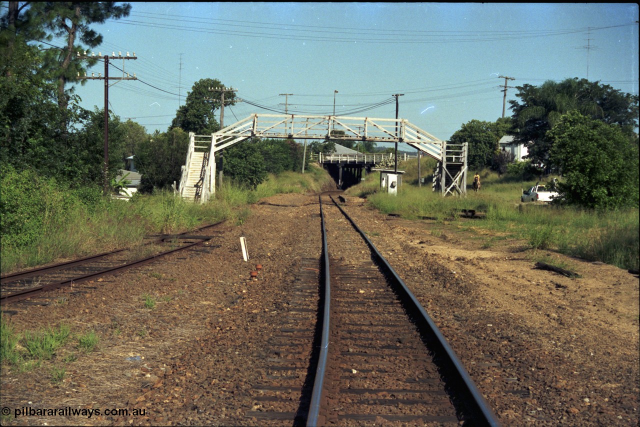 187-01
Nashville, Gympie Queensland. View looking south in the Up direction, footbridge still intact, low level platform and passenger shelter, Graham St overbridge in distance. Ute on the right would be on what is now Nashville Lane. [url=https://goo.gl/maps/q1dyp7EeiNB2]GeoData[/url].
