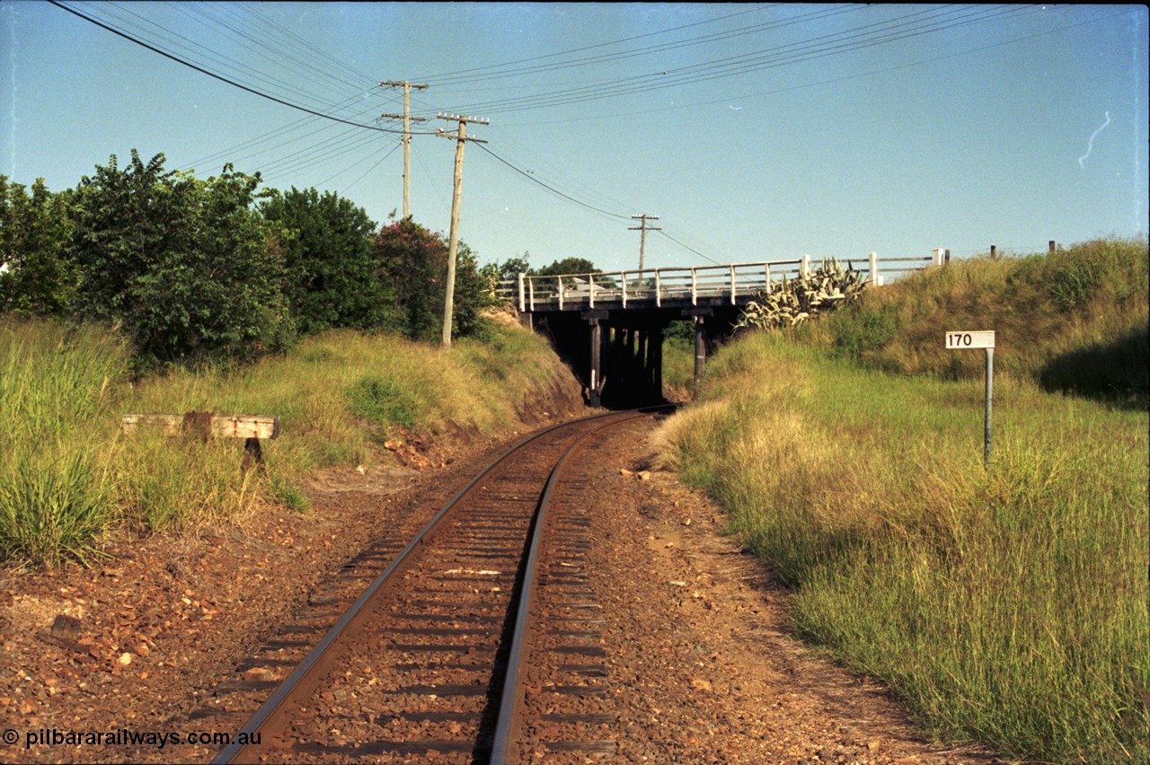 187-03
Nashville, Gympie Queensland. Looking south east in the Up direction with the 170 km post and the Graham St over bridge. [url=https://goo.gl/maps/ipD7mZ8bqy42]GeoData[/url].
